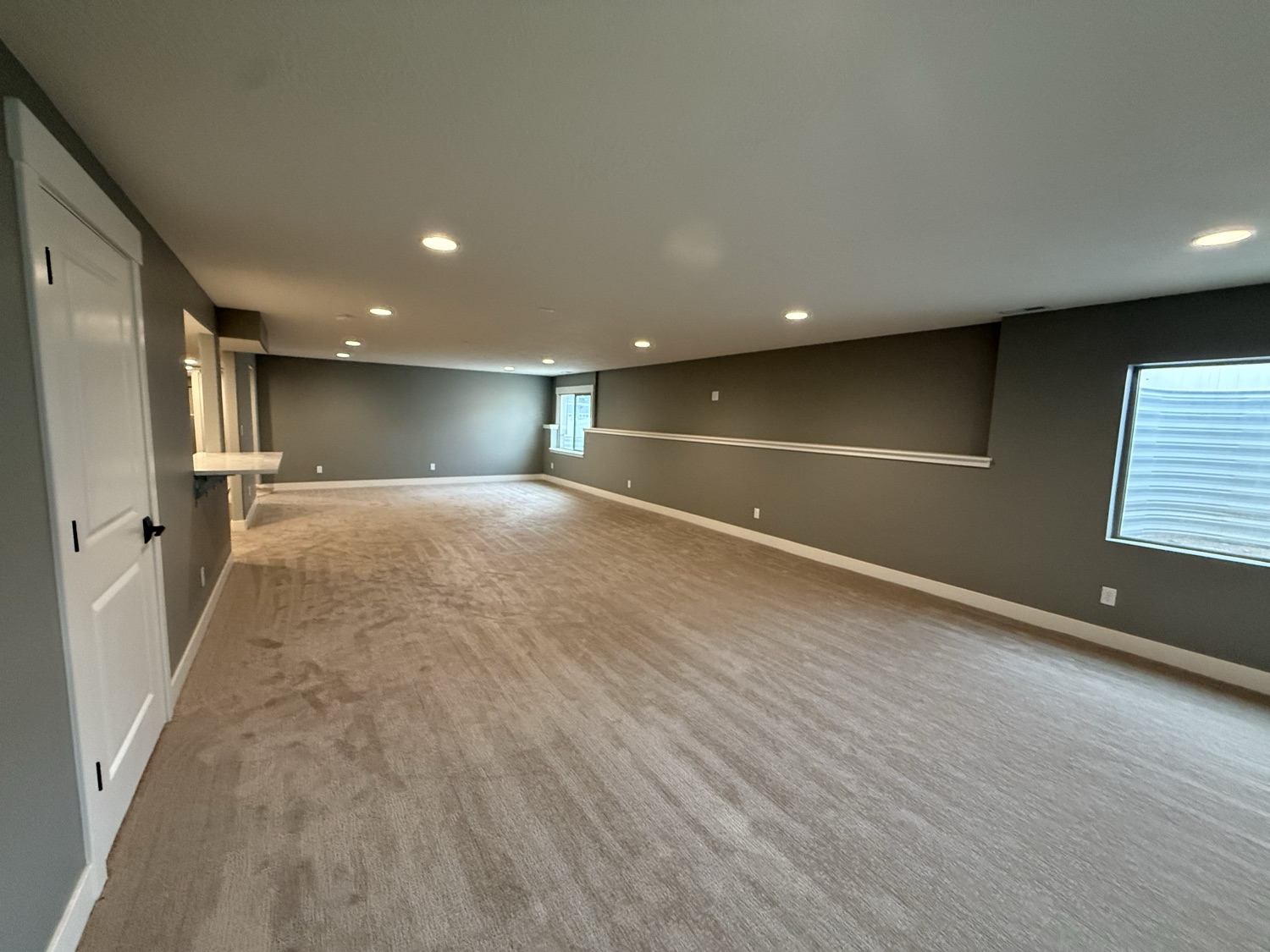 Finished basement living area by Lynnwood Construction