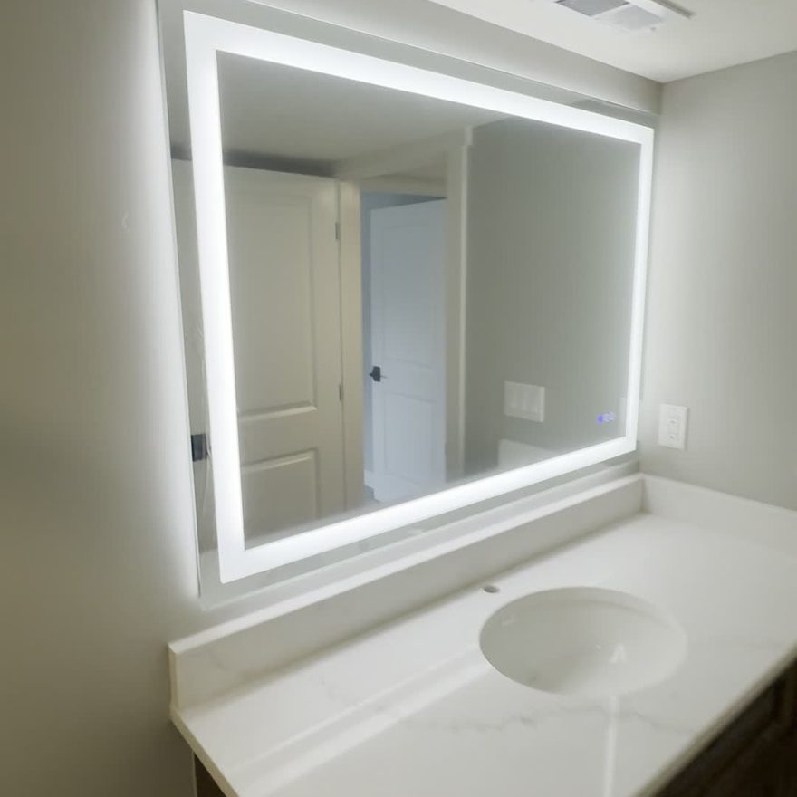 Bathroom remodel with quartz vanity and LED mirror by Lynnwood Construction