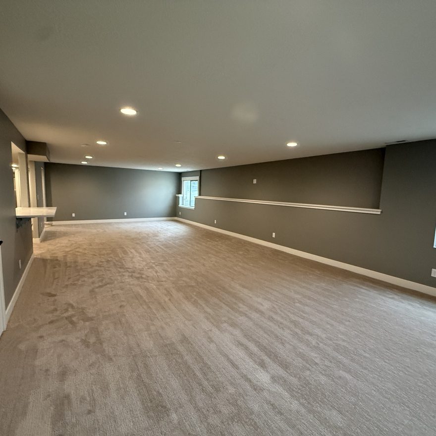 Finished basement living room by Lynnwood Construction in Utah County