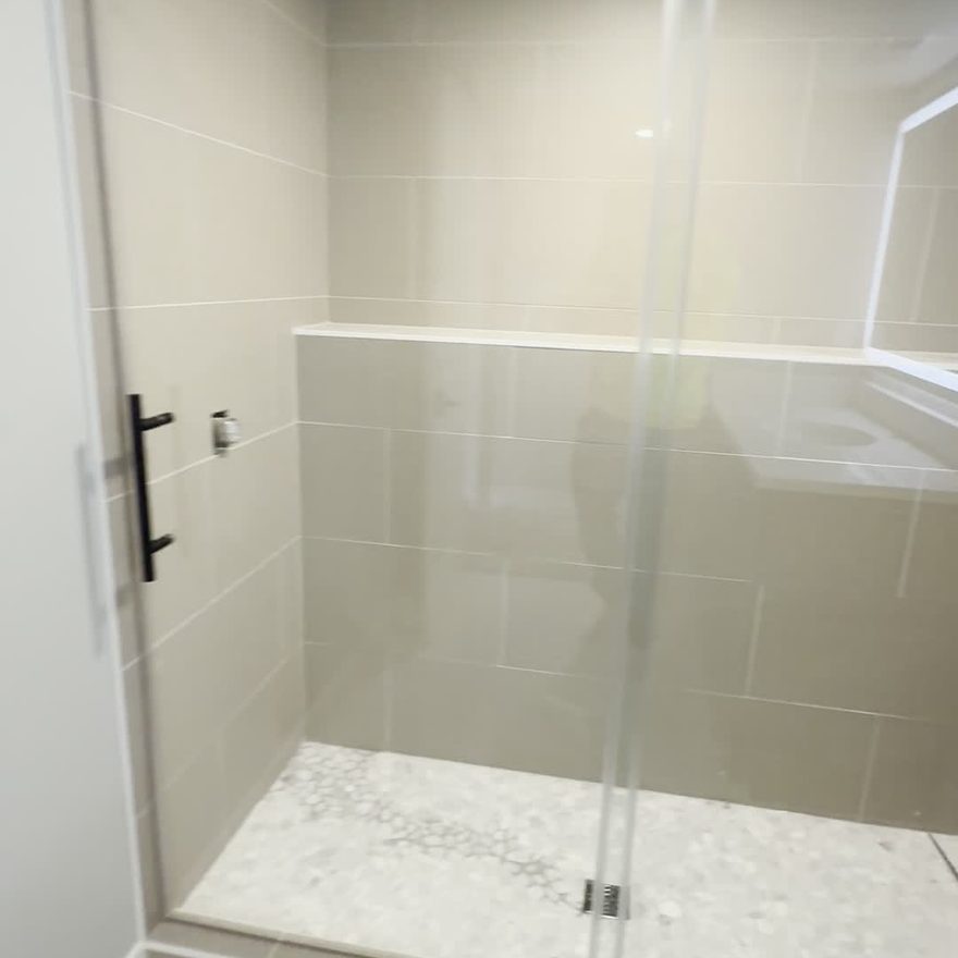 Walk-in tile shower with glass by Lynnwood Construction