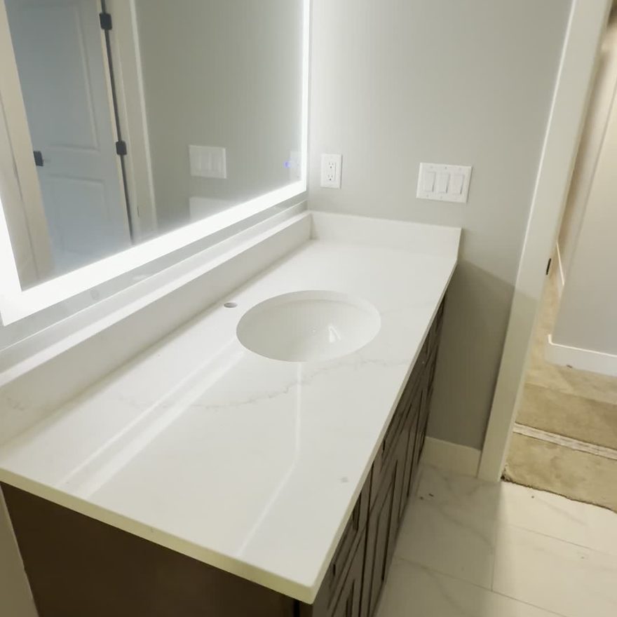 Bathroom remodel with quartz vanity by Lynnwood Construction