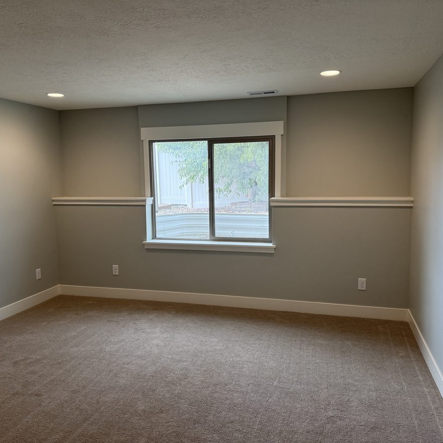 Finished basement bedroom by Lynnwood Construction